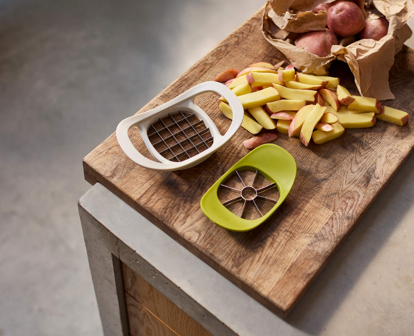 [half-width] Nest™ Press 2-in-1 Fruit & Vegetable Cutter
