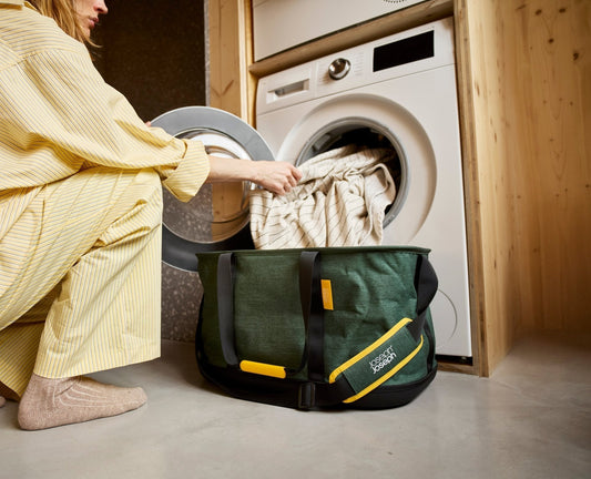 [hidden] [lifestyle] Hold-All™ Outdoor Green Collapsible 45L Laundry Basket
